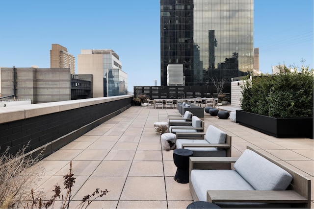 view of patio / terrace with an outdoor hangout area and a view of city