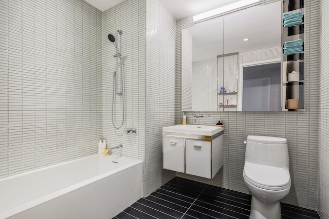 252 S St Unit 76E, New York City, NY 10002 - full bathroom with tile walls, bathing tub / shower combination, vanity, toilet, and tile patterned flooring