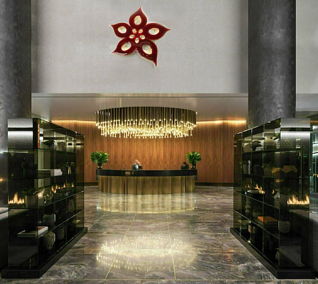 252 S St Unit 76E, New York City, NY 10002 - welcome area featuring a chandelier and a towering ceiling
