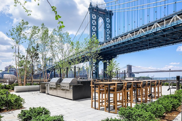 252 S St Unit 76E, New York City, NY 10002 - view of patio featuring an outdoor kitchen and a grill