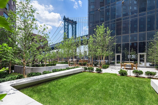 252 S St Unit 76E, New York City, NY 10002 - view of community featuring a lawn