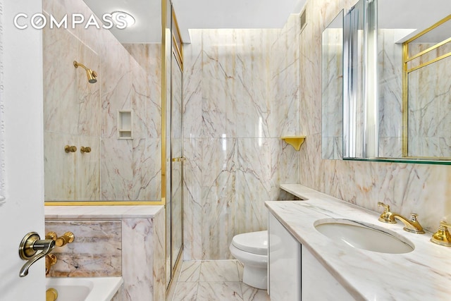 full bath featuring a marble finish shower, tile walls, toilet, a bathing tub, and vanity