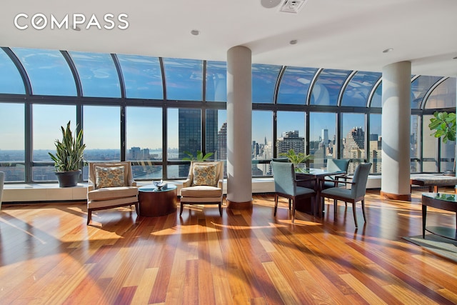 sunroom featuring a city view