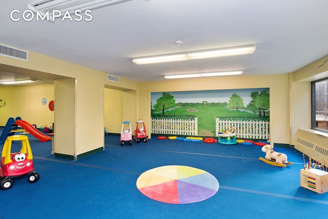 game room featuring baseboards and visible vents