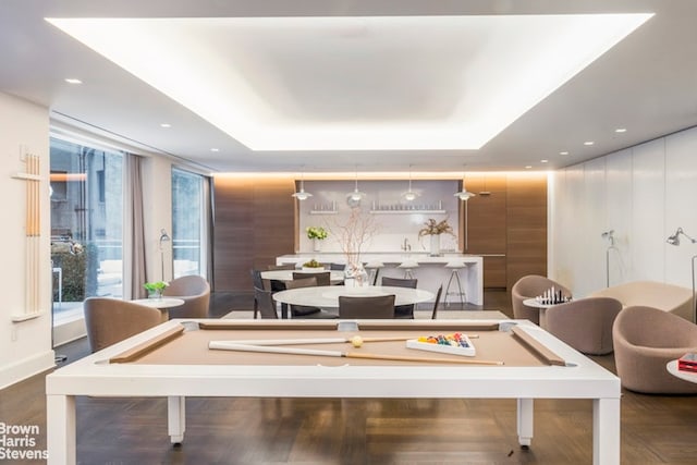 rec room with pool table and a tray ceiling