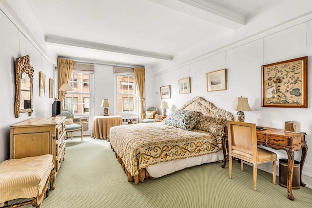 carpeted bedroom with beamed ceiling