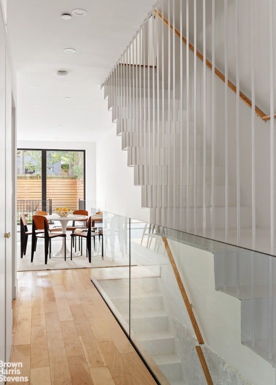 staircase with floor to ceiling windows