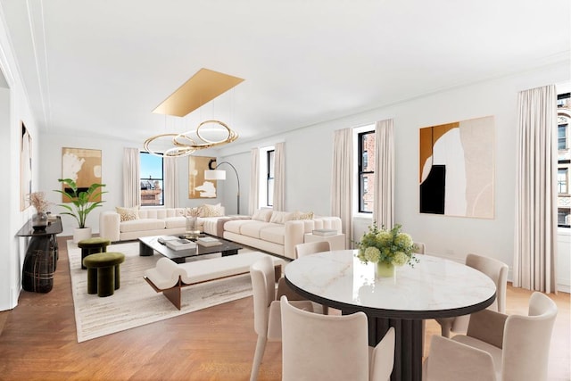 dining room featuring parquet floors and a healthy amount of sunlight