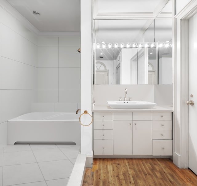 bathroom with vanity, bathing tub / shower combination, and hardwood / wood-style floors