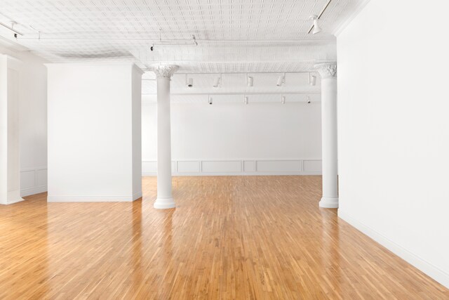 hallway with light hardwood / wood-style floors