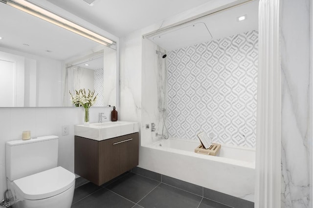 full bathroom with tiled shower / bath combo, tile patterned flooring, vanity, and toilet