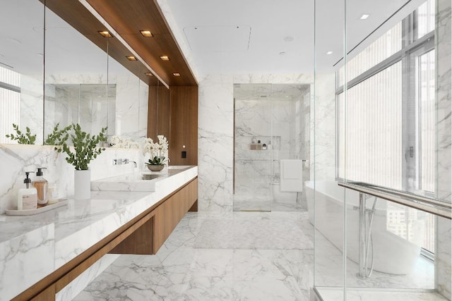 bathroom with vanity and a shower with shower door