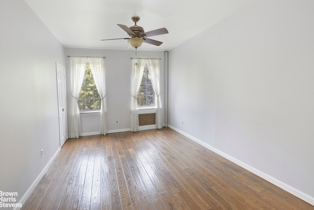 empty room featuring ceiling fan and light hardwood / wood-style flooring