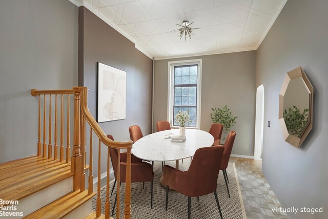 dining room with hardwood / wood-style flooring and ceiling fan