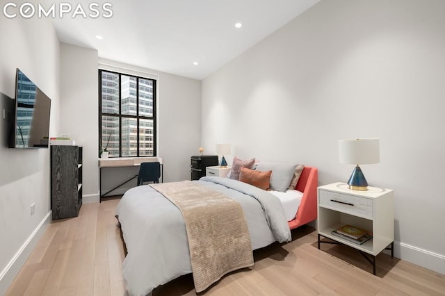 bedroom with light wood-type flooring