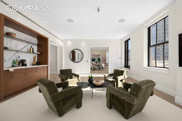 100 Barclay St Unit 21Ad, New York City, NY 10007 - living room featuring a dry bar and baseboards