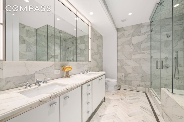 100 Barclay St Unit 21Ad, New York City, NY 10007 - bathroom featuring a marble finish shower, double vanity, toilet, recessed lighting, and tile walls