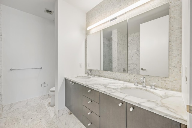 46-30 Center Blvd Unit 401, New York City, NY 11109 - full bath with marble finish floors, double vanity, and a marble finish shower