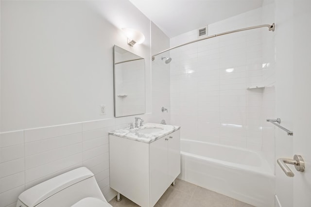 46-30 Center Blvd Unit 401, New York City, NY 11109 - full bathroom featuring washtub / shower combination, vanity, tile patterned flooring, and tile walls