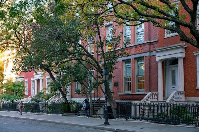 view of building exterior featuring fence