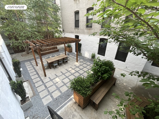 view of patio / terrace with a pergola and outdoor dining area