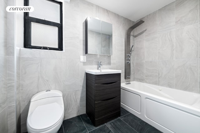 full bathroom featuring toilet, shower / bath combination, tile walls, and vanity