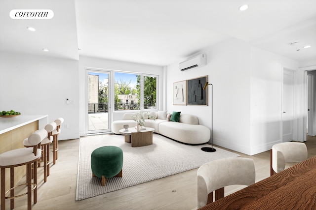 living room featuring a wall unit AC and light hardwood / wood-style flooring