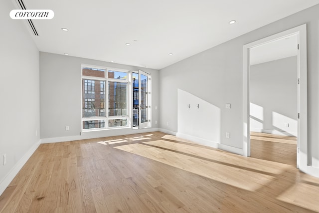 unfurnished living room with light hardwood / wood-style floors