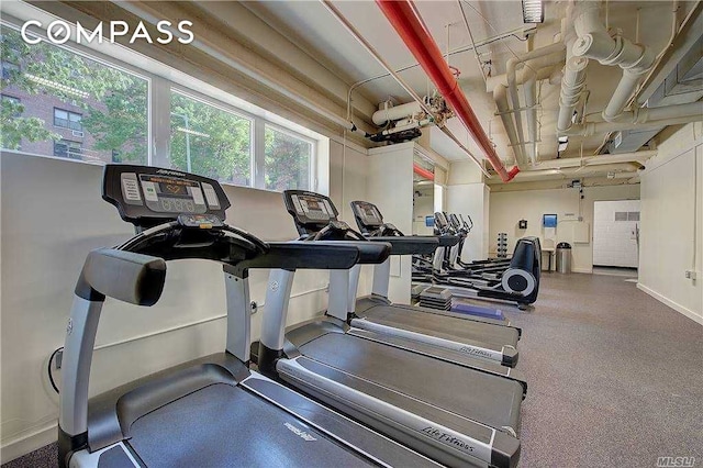 exercise room with baseboards