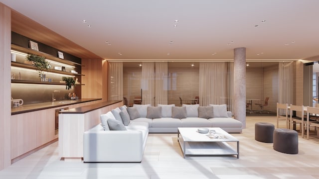 living room with wet bar and wood walls