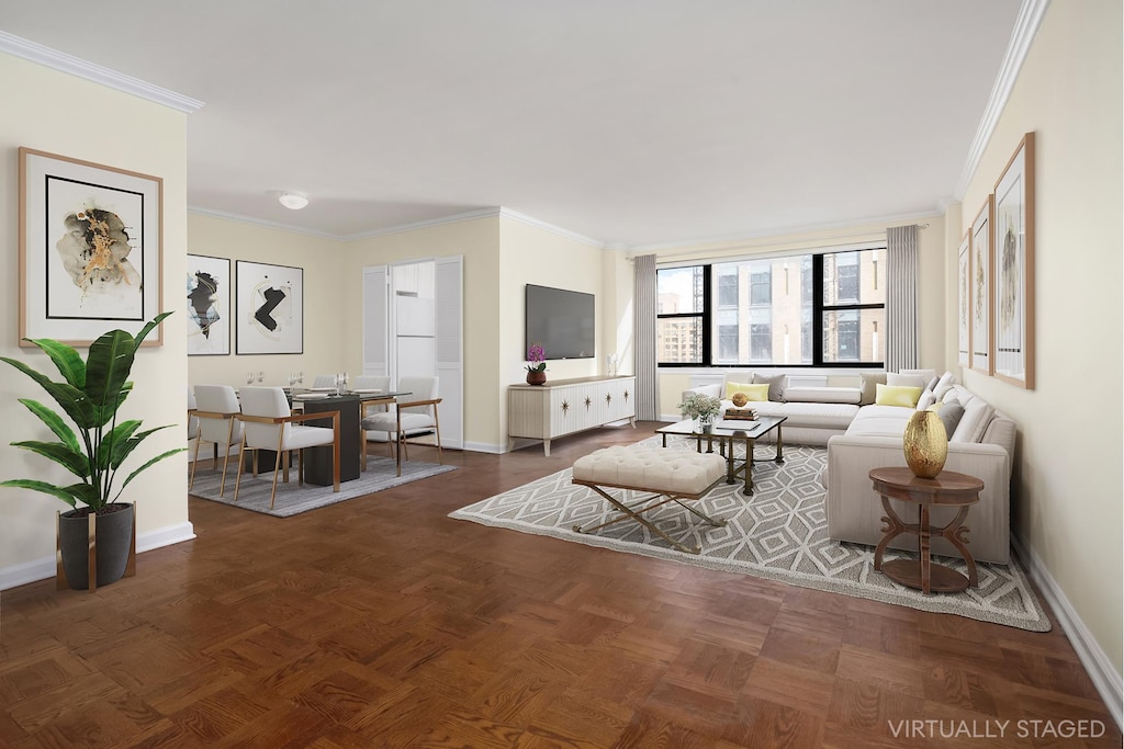 living area featuring ornamental molding and baseboards