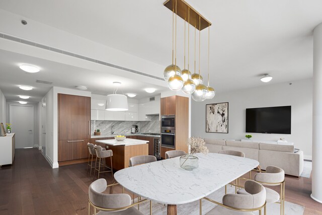 dining space featuring dark hardwood / wood-style flooring