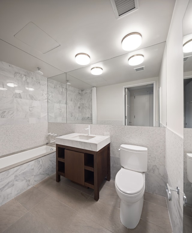 full bath with visible vents, toilet, and tile walls