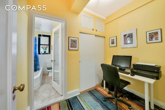 office space featuring tile patterned floors, french doors, baseboards, and tile walls