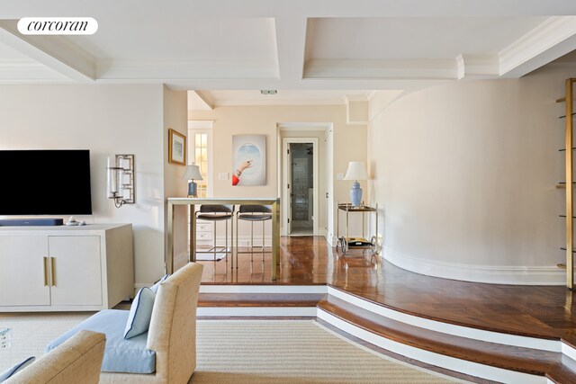 living room featuring crown molding, coffered ceiling, and beam ceiling