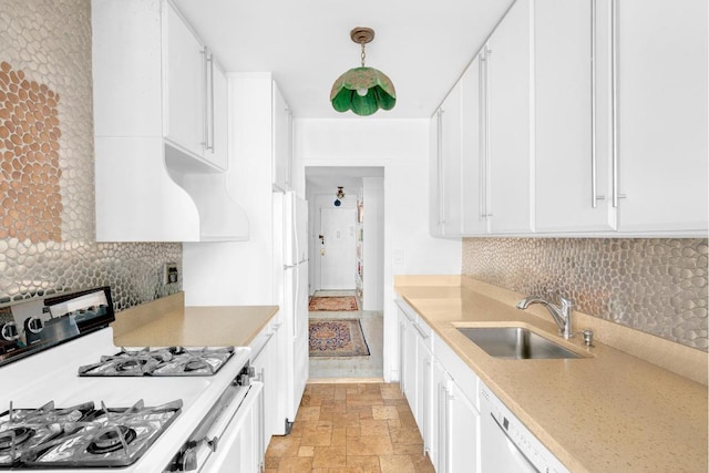 kitchen with white cabinetry, hanging light fixtures, and white appliances