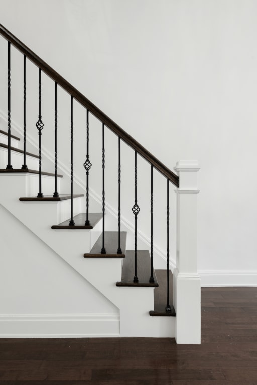 staircase with hardwood / wood-style flooring