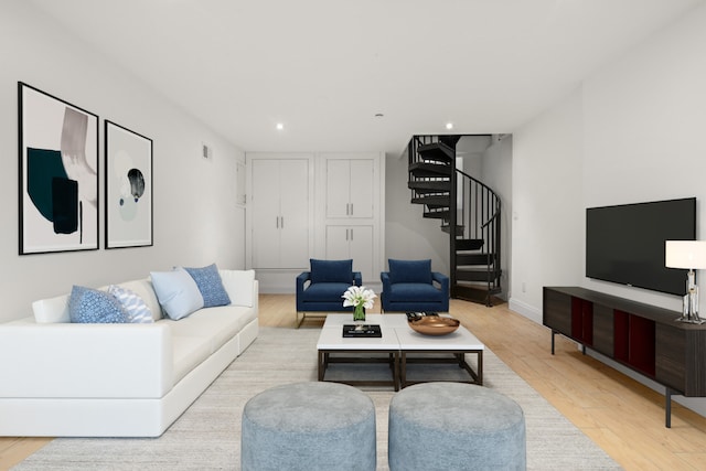 living room featuring recessed lighting, visible vents, stairway, and light wood-type flooring