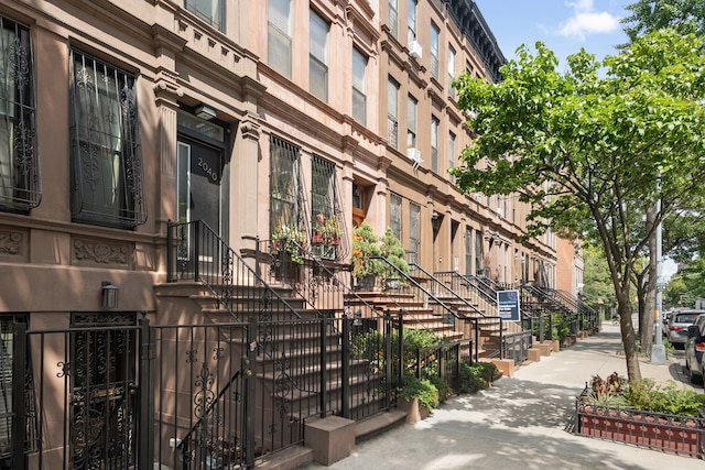 view of property with stairway