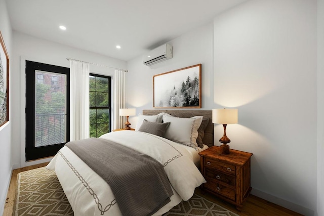 bedroom featuring a wall mounted air conditioner and hardwood / wood-style flooring