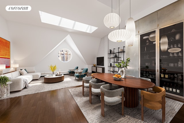 dining area featuring dark hardwood / wood-style floors and lofted ceiling with skylight