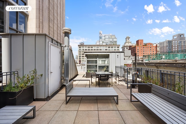 view of patio / terrace featuring a city view and a balcony