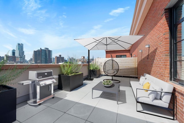 view of patio with a grill, an outdoor living space, and a balcony