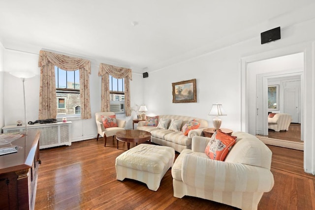 living room featuring radiator and dark hardwood / wood-style floors