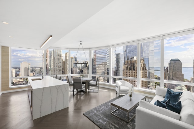 interior space featuring a city view, plenty of natural light, and a sink