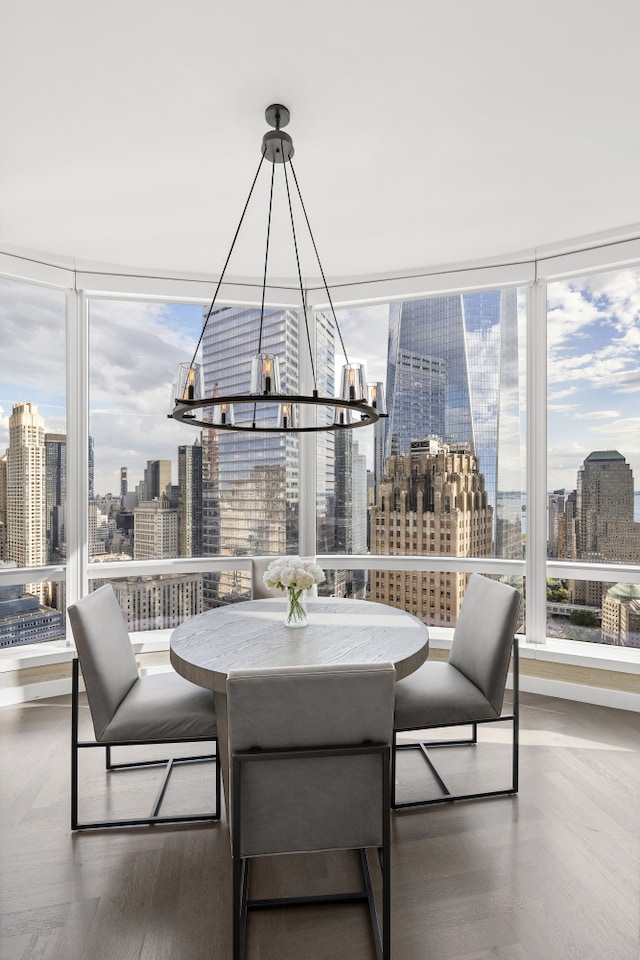 sunroom / solarium with a wealth of natural light and a city view