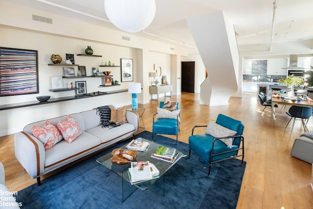 living room with light hardwood / wood-style flooring