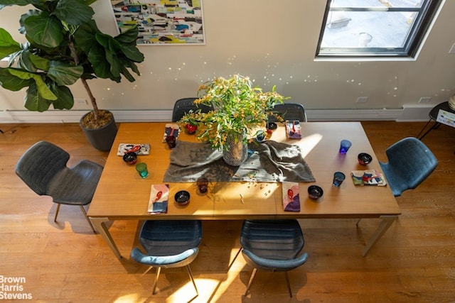 dining area with wood-type flooring