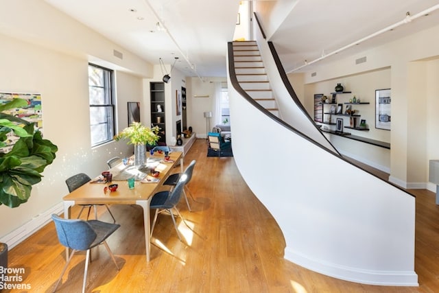 dining area with light hardwood / wood-style floors