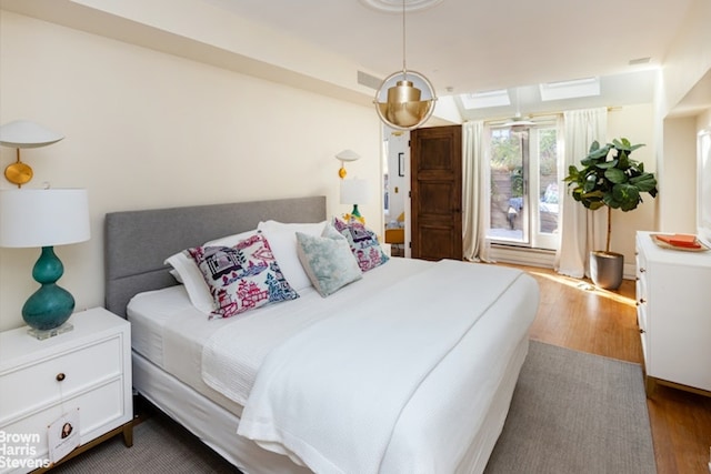 bedroom featuring wood-type flooring